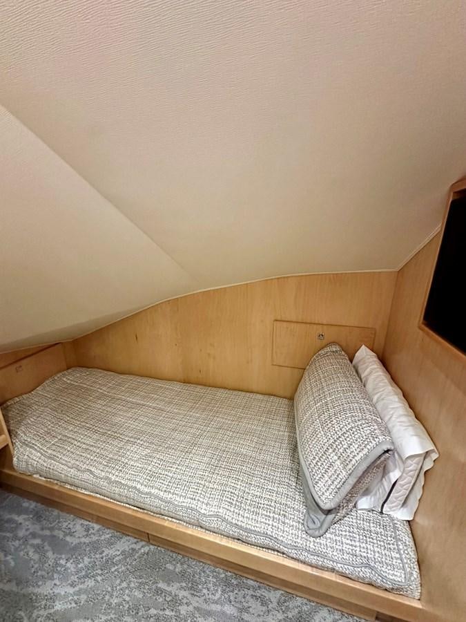 a bed with a pillow aboard FREAK SHOW Yacht for Sale