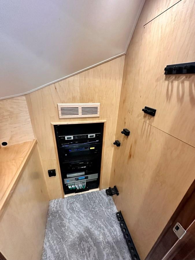 a wood cabinet with a vent aboard FREAK SHOW Yacht for Sale