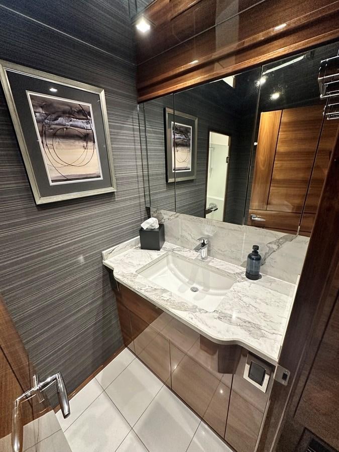 a bathroom with a sink and mirror aboard FREAK SHOW Yacht for Sale