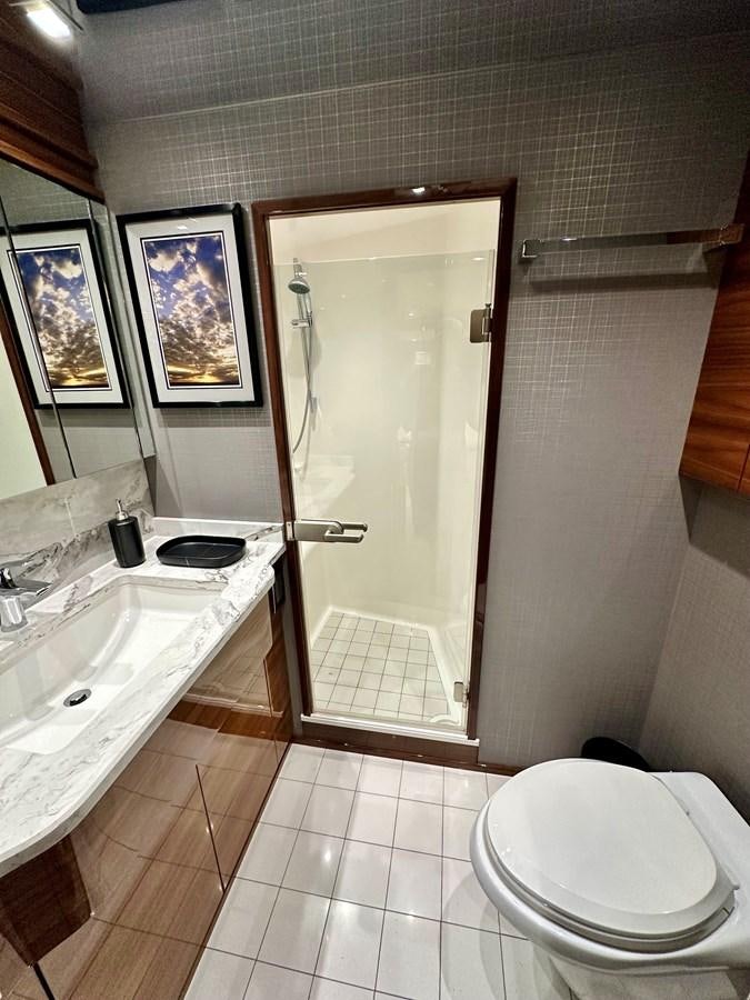a bathroom with a sink and a toilet aboard FREAK SHOW Yacht for Sale