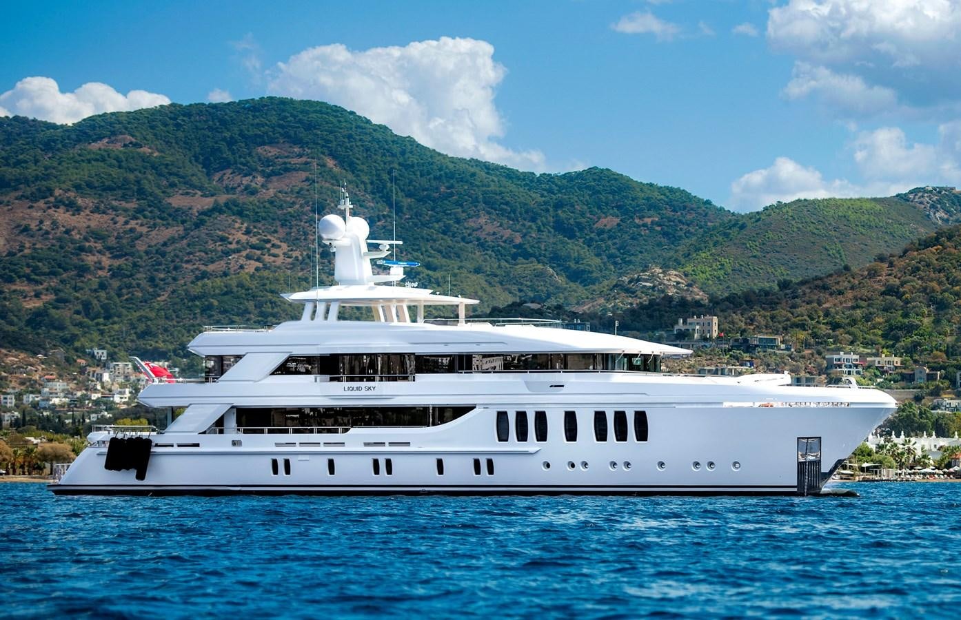 a large white boat in the water aboard LIQUID SKY Yacht for Sale