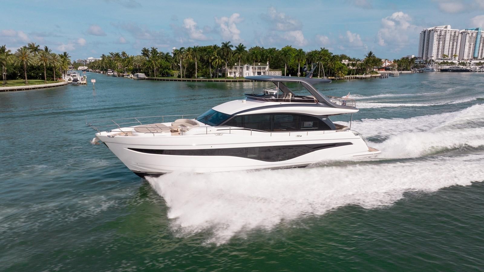 a white boat on the water aboard DROPLET Yacht for Sale