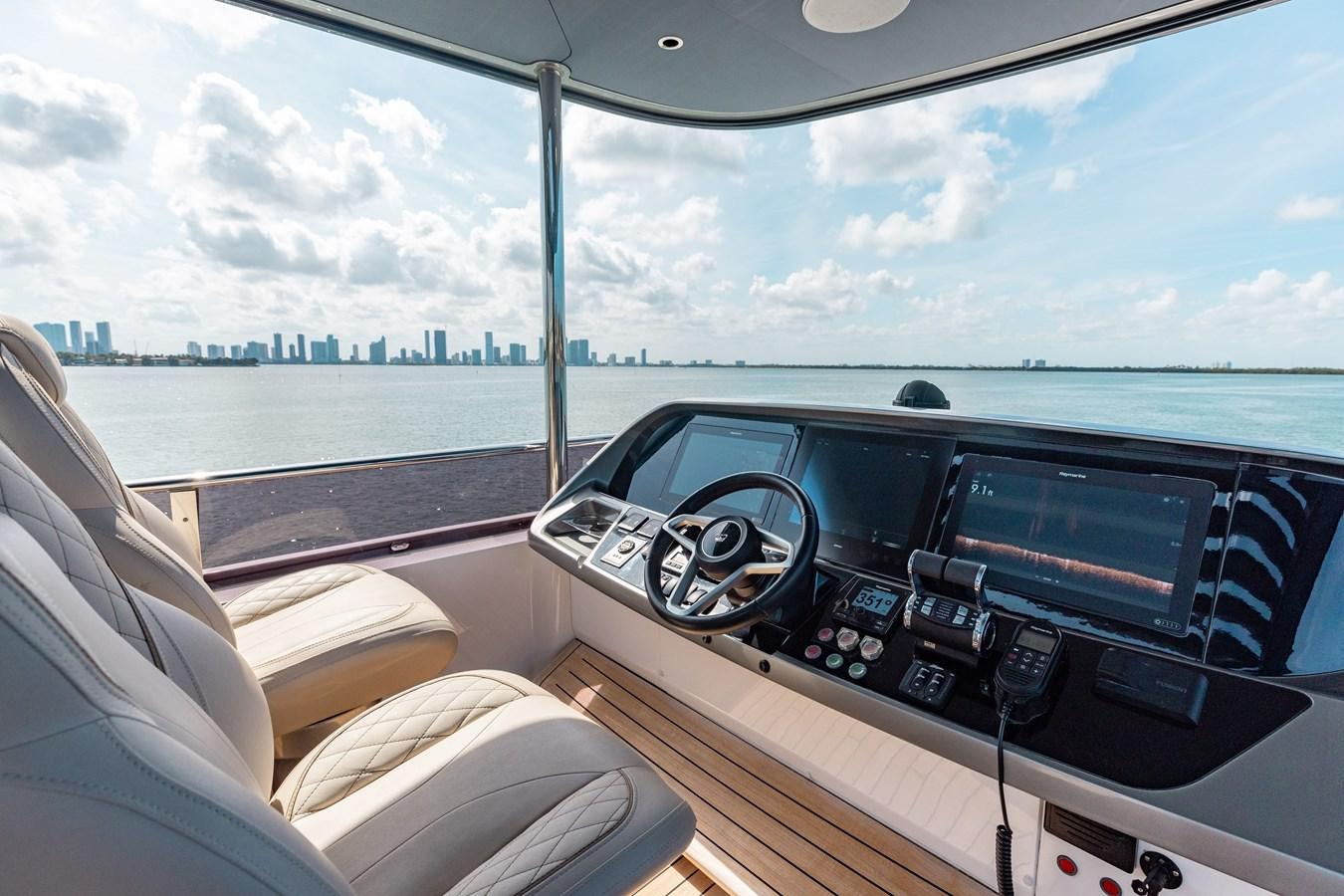 inside of a car aboard DROPLET Yacht for Sale