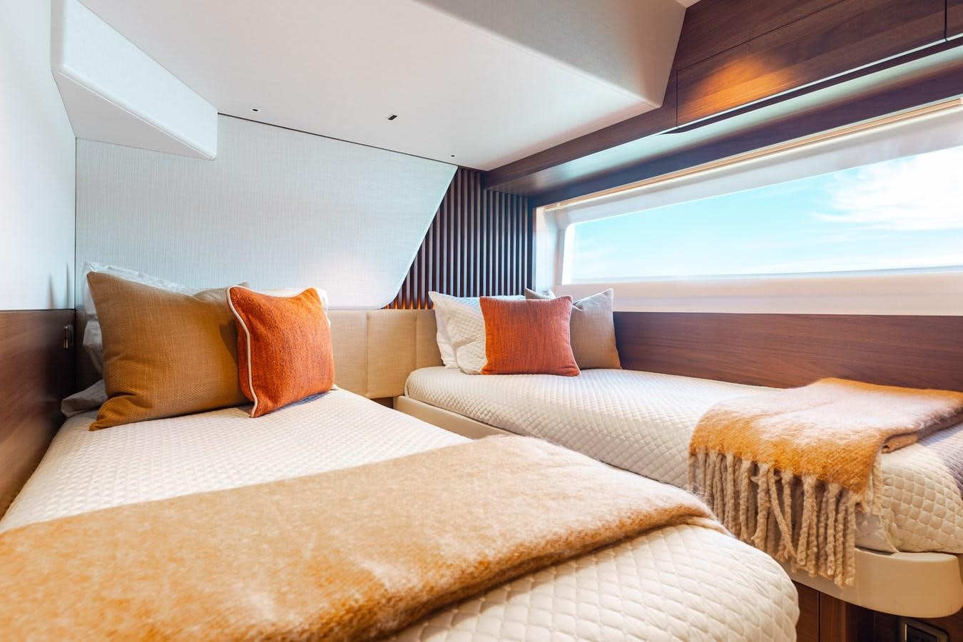 a room with two beds aboard DROPLET Yacht for Sale