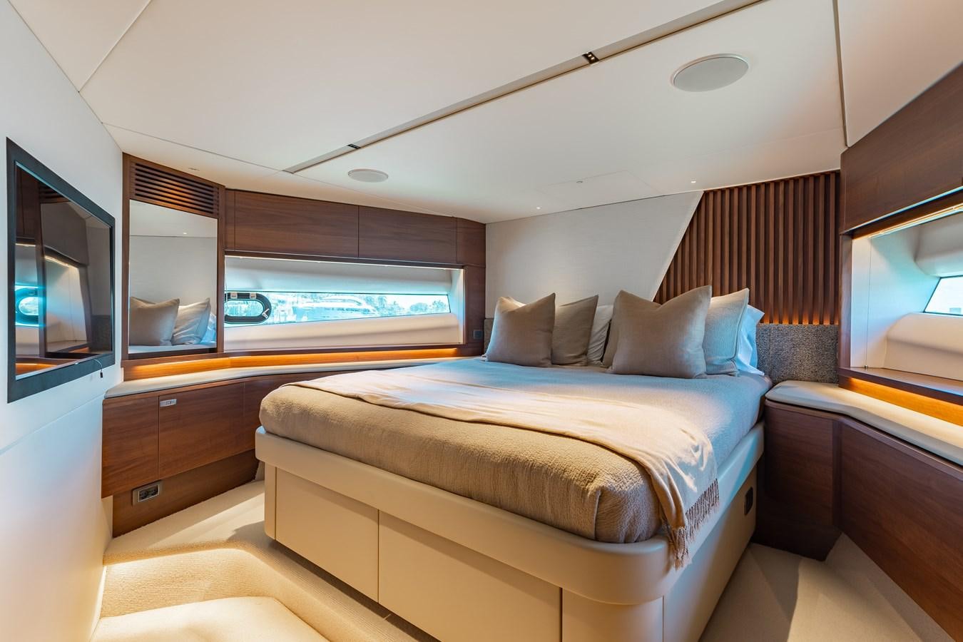 a bed in a room aboard DROPLET Yacht for Sale
