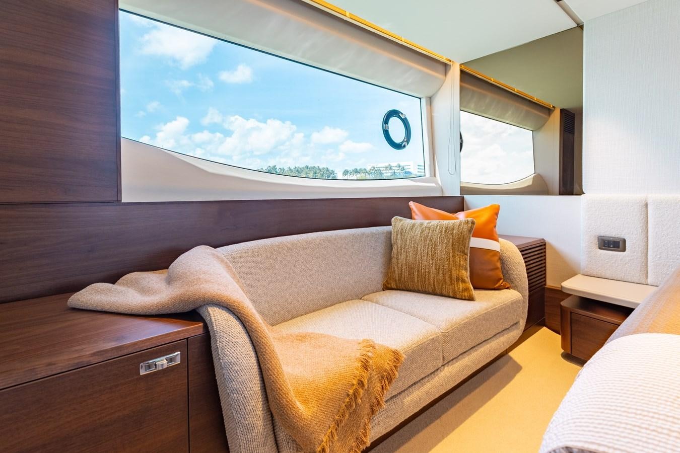 a couch in a room aboard DROPLET Yacht for Sale