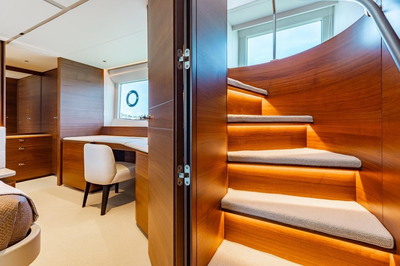 a room with a chair and desk aboard DROPLET Yacht for Sale