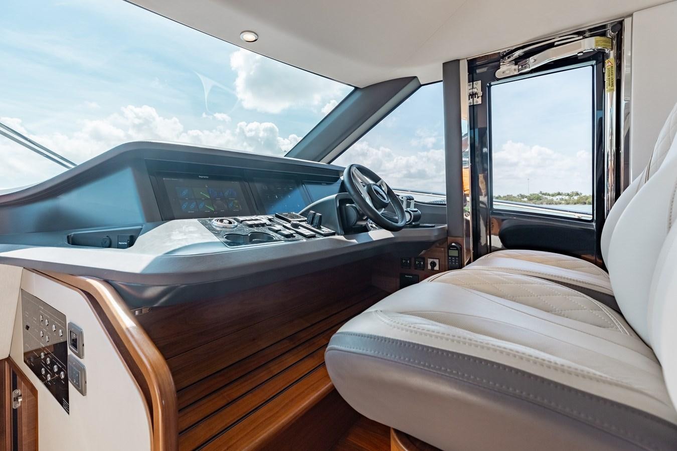 a car with a door open aboard DROPLET Yacht for Sale