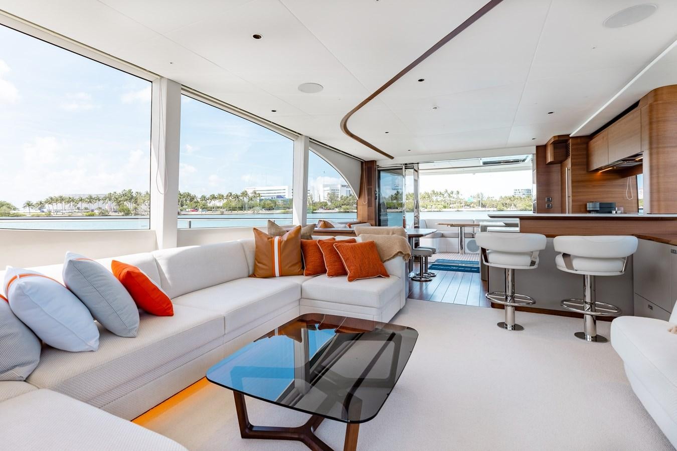 a living room with a large window aboard DROPLET Yacht for Sale
