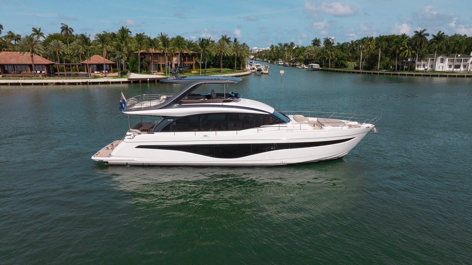 a white boat in the water aboard DROPLET Yacht for Sale