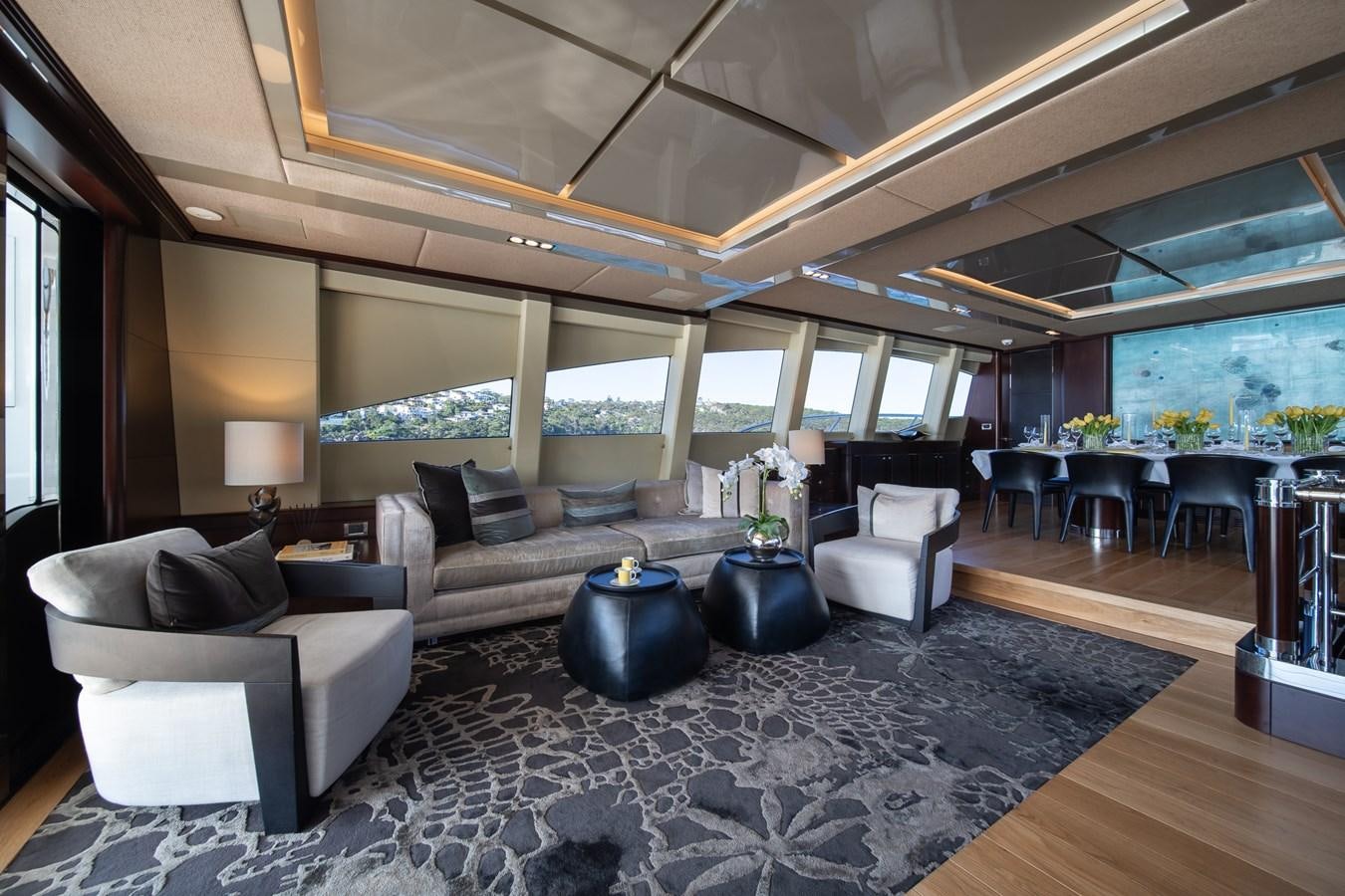 a large living room with a large window aboard QUANTUM Yacht for Sale