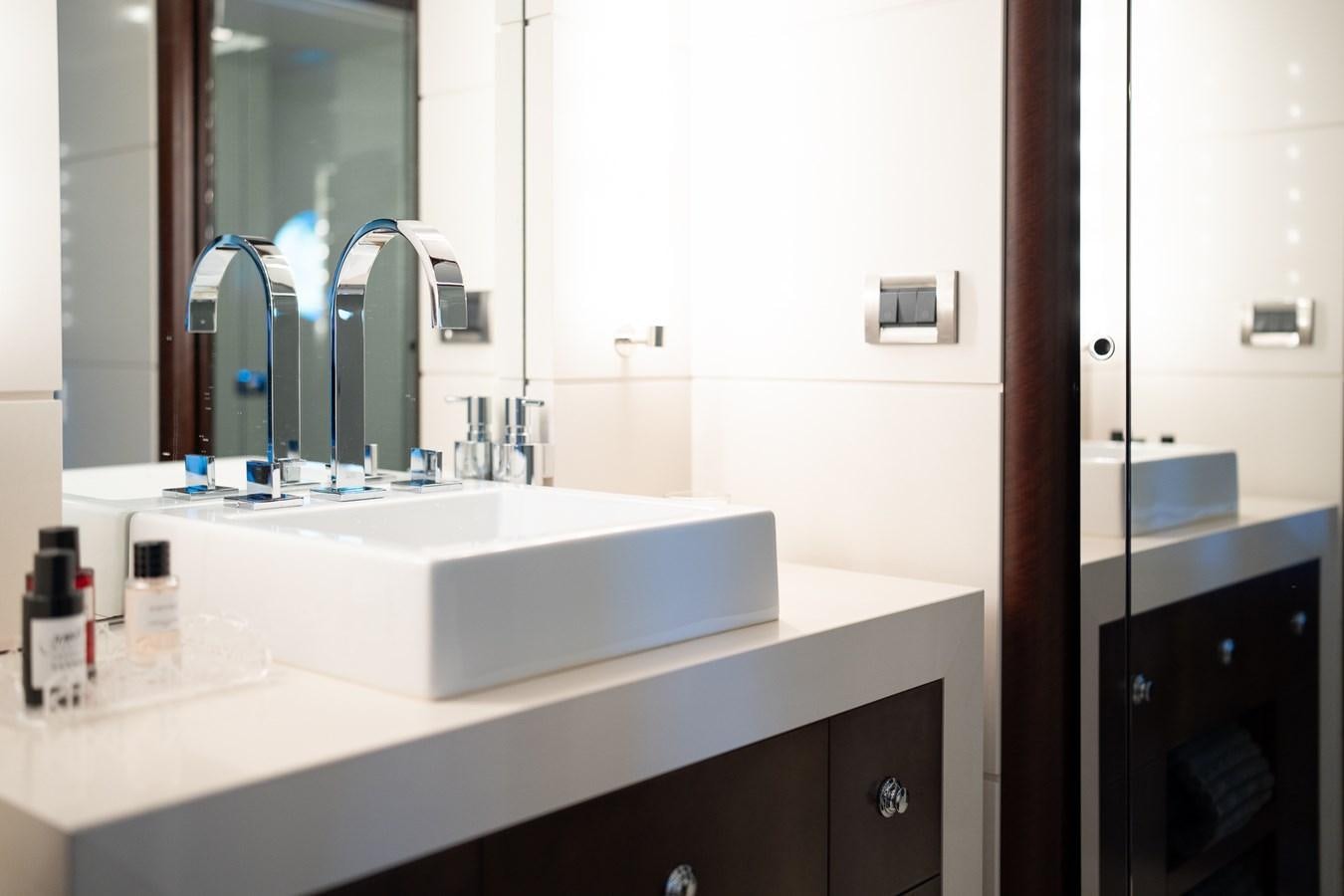 a bathroom with a sink and a mirror aboard QUANTUM Yacht for Sale