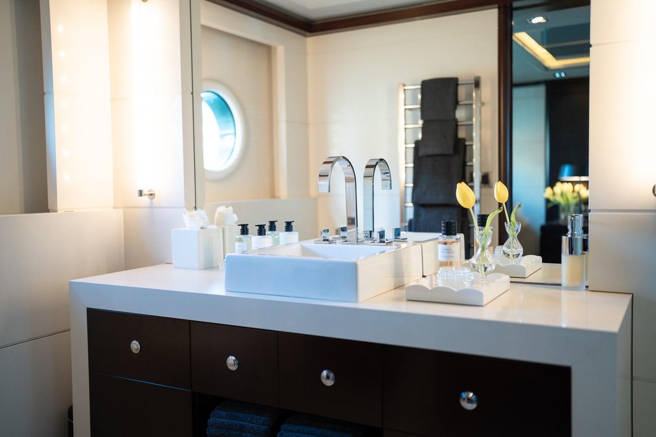 a bathroom with a large mirror aboard QUANTUM Yacht for Sale