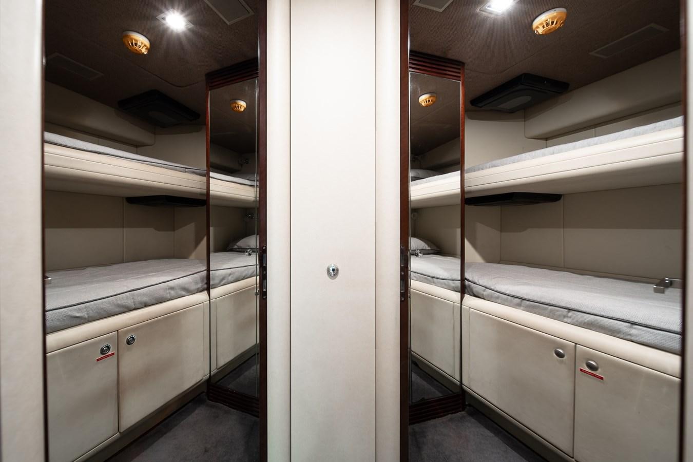 a hallway with white doors aboard QUANTUM Yacht for Sale