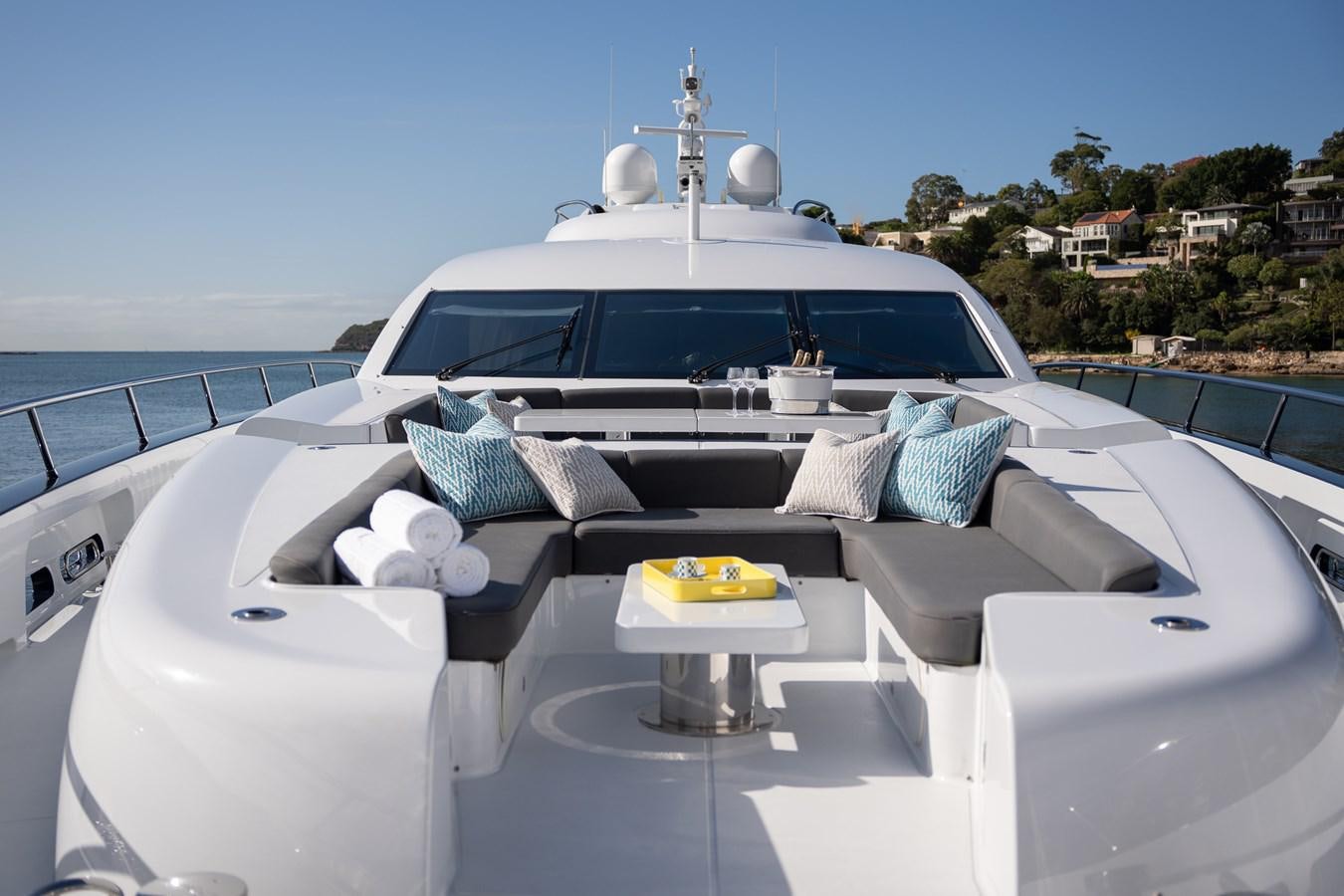 a white car with a white roof and a white roof with a blue sky and water in the aboard QUANTUM Yacht for Sale