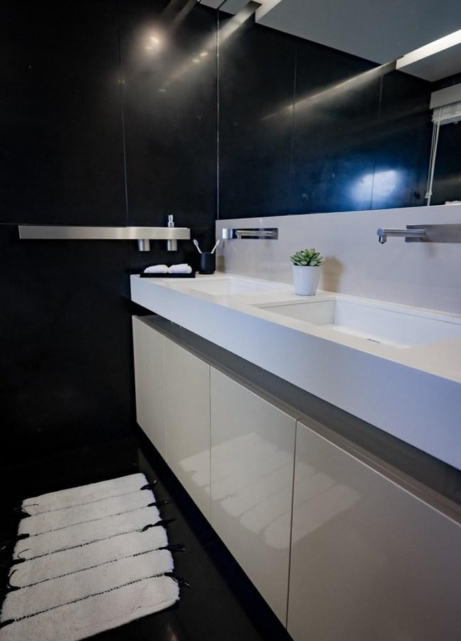 a modern bathroom with a wood floor aboard CANADOS FLYBRIDGE FAST Yacht for Sale