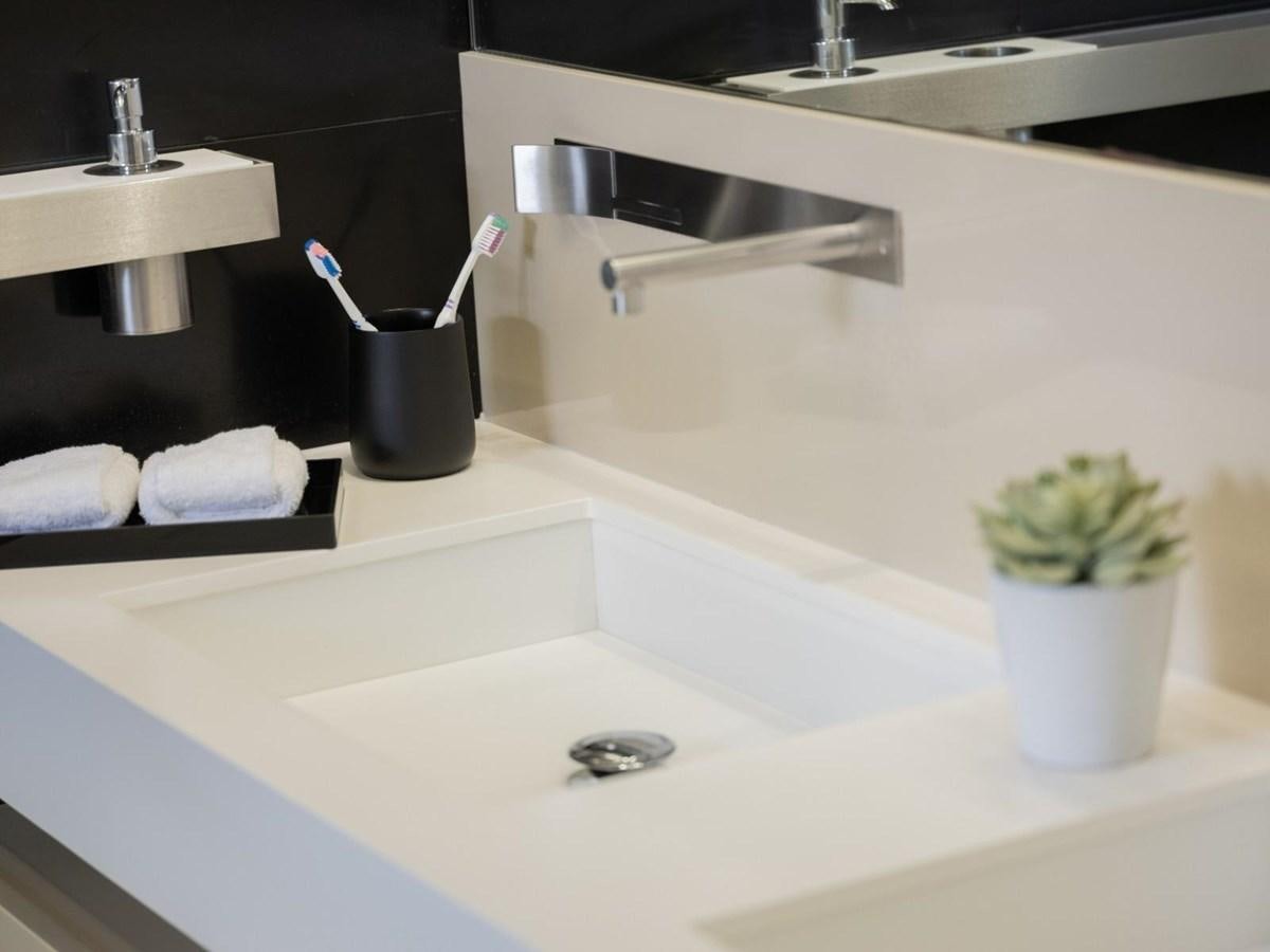 a bathroom sink with a plant on the counter aboard CANADOS FLYBRIDGE FAST Yacht for Sale