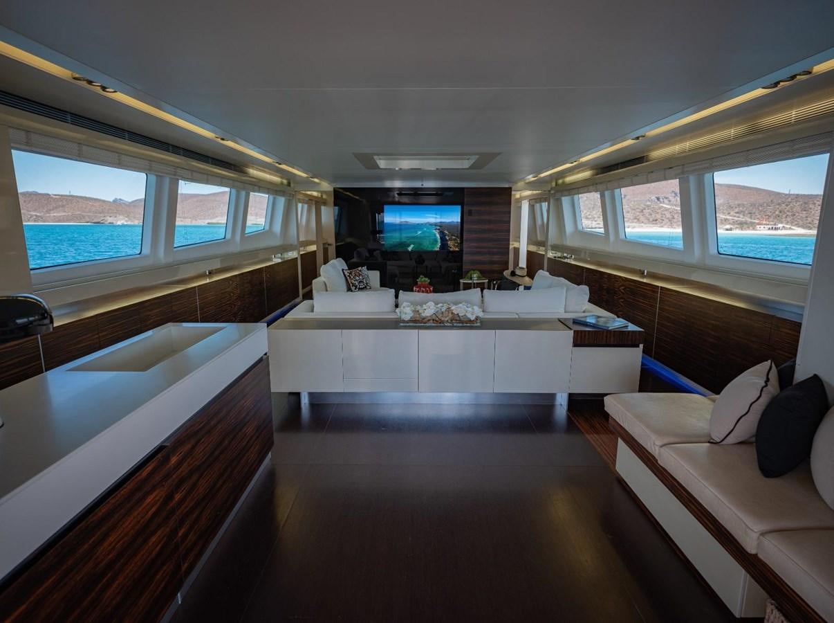 a room with a large bed and a large window aboard CANADOS FLYBRIDGE FAST Yacht for Sale