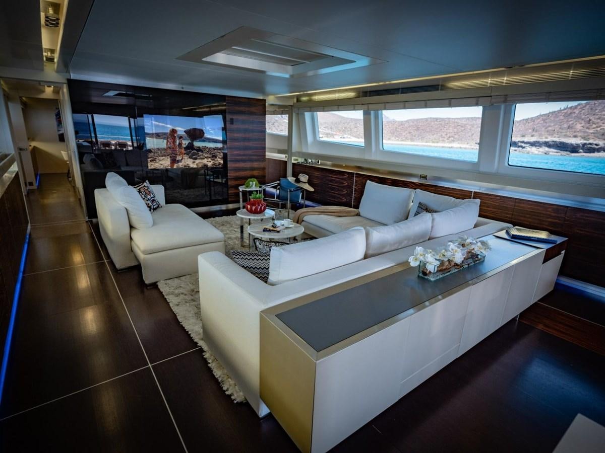 a room with a couch and a table aboard CANADOS FLYBRIDGE FAST Yacht for Sale