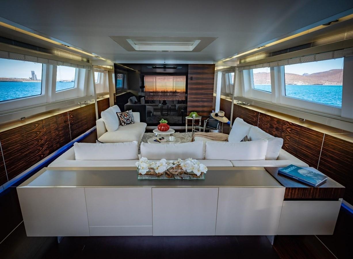 a living room with a large window aboard CANADOS FLYBRIDGE FAST Yacht for Sale
