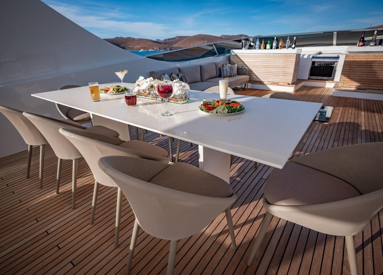 a table with food on it aboard CANADOS FLYBRIDGE FAST Yacht for Sale