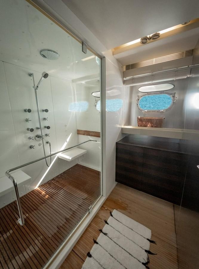 a bathroom with a shower unit aboard CANADOS FLYBRIDGE FAST Yacht for Sale