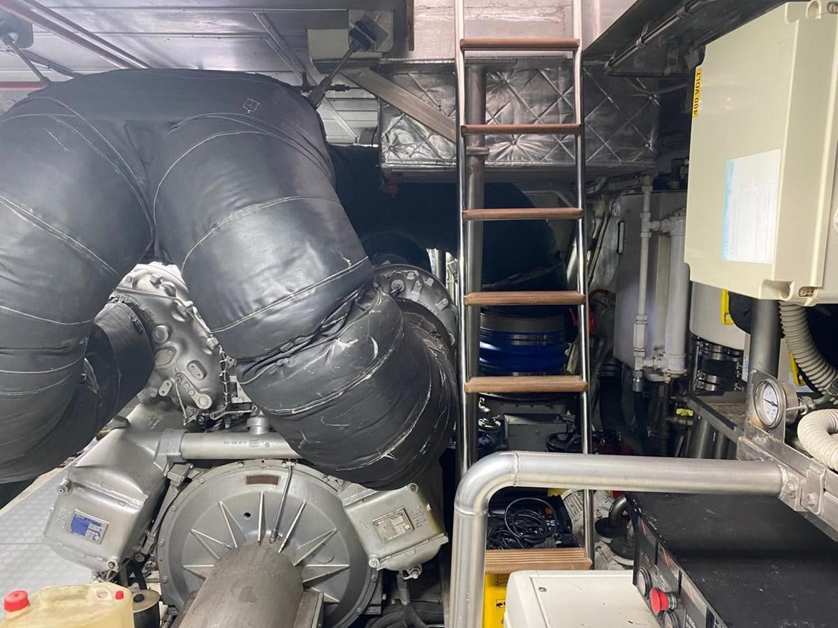 a large black vehicle with a large black tire aboard CANADOS FLYBRIDGE FAST Yacht for Sale