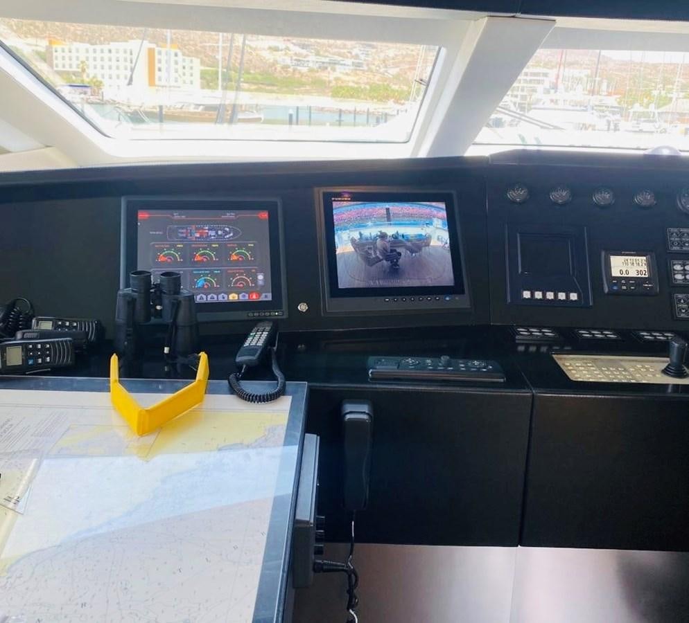 a room with computers and monitors aboard CANADOS FLYBRIDGE FAST Yacht for Sale