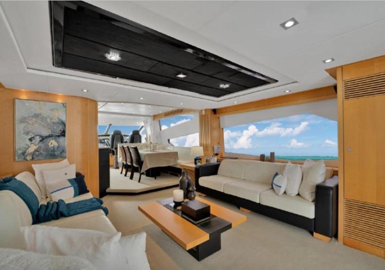 a living room with a large window aboard SUNSEEKER 88  Yacht for Sale