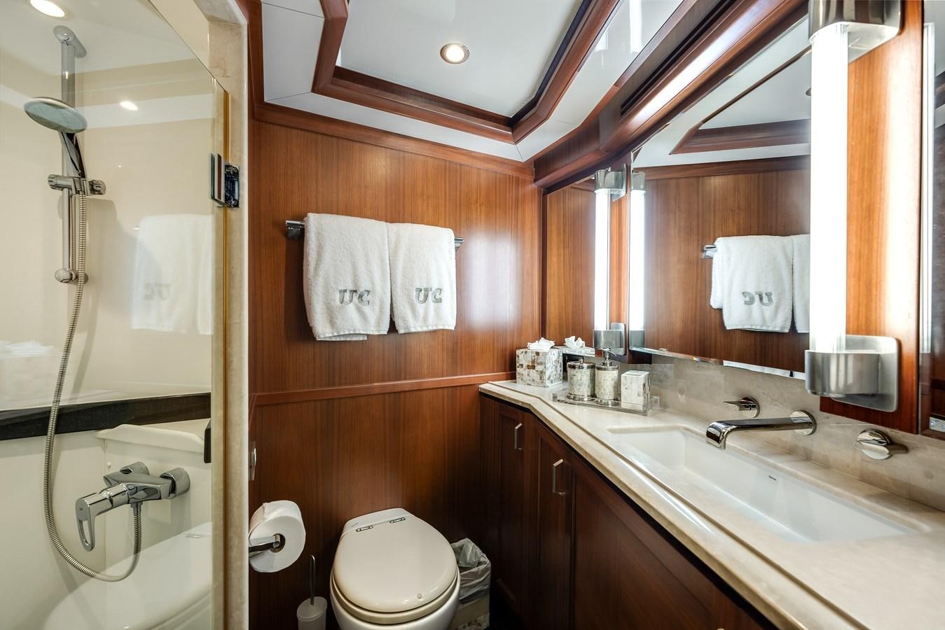 a bathroom with a sink and a mirror aboard UNCORKED Yacht for Sale