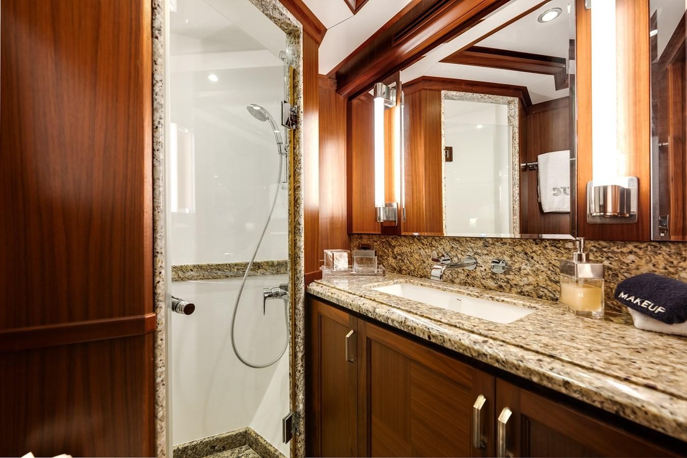 a bathroom with a shower and sink aboard UNCORKED Yacht for Sale