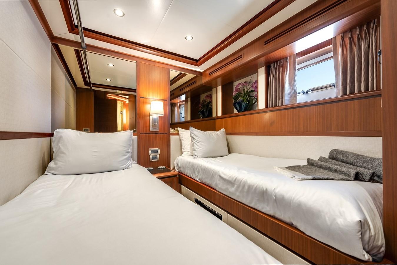 a couple of beds in a room aboard UNCORKED Yacht for Sale