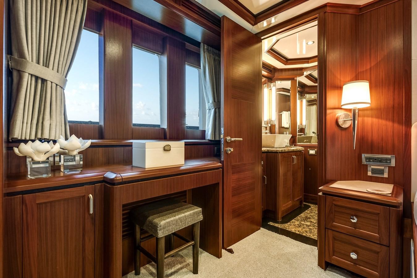 a kitchen with a counter and stools aboard UNCORKED Yacht for Sale