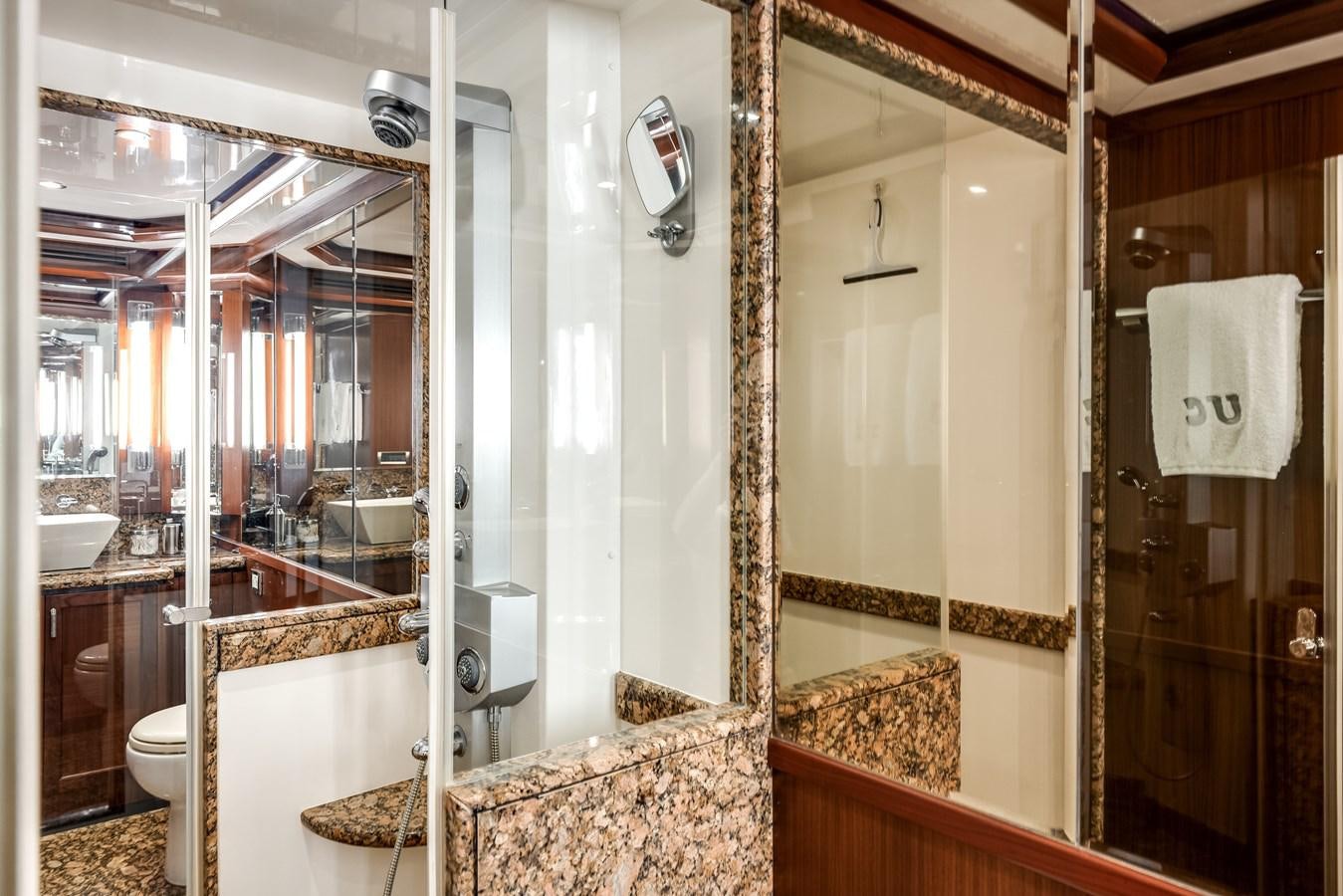 a bathroom with a glass shower aboard UNCORKED Yacht for Sale