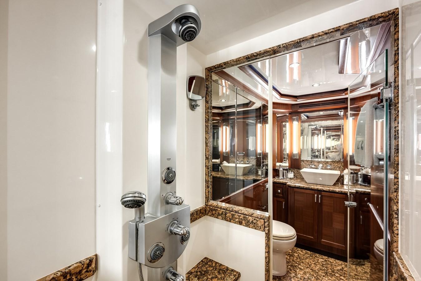a bathroom with a large mirror aboard UNCORKED Yacht for Sale