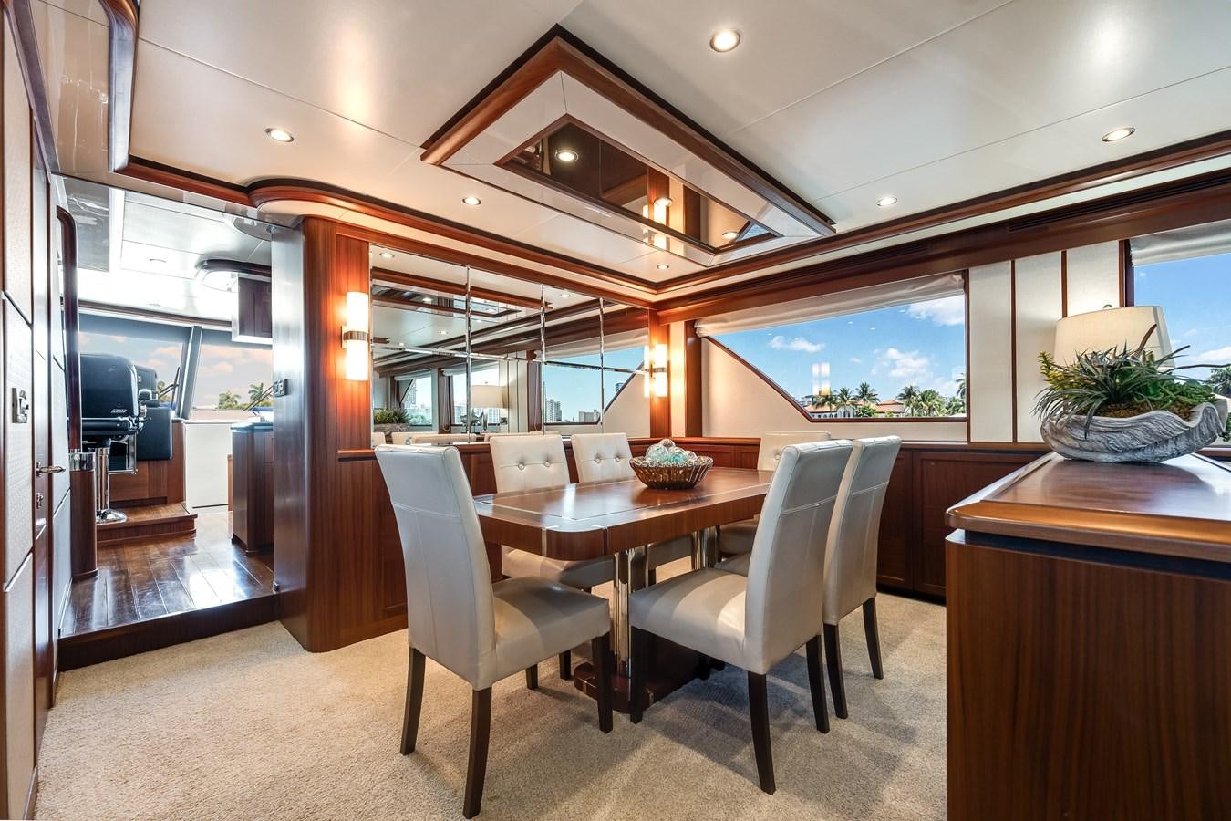 a room with a table and chairs aboard UNCORKED Yacht for Sale
