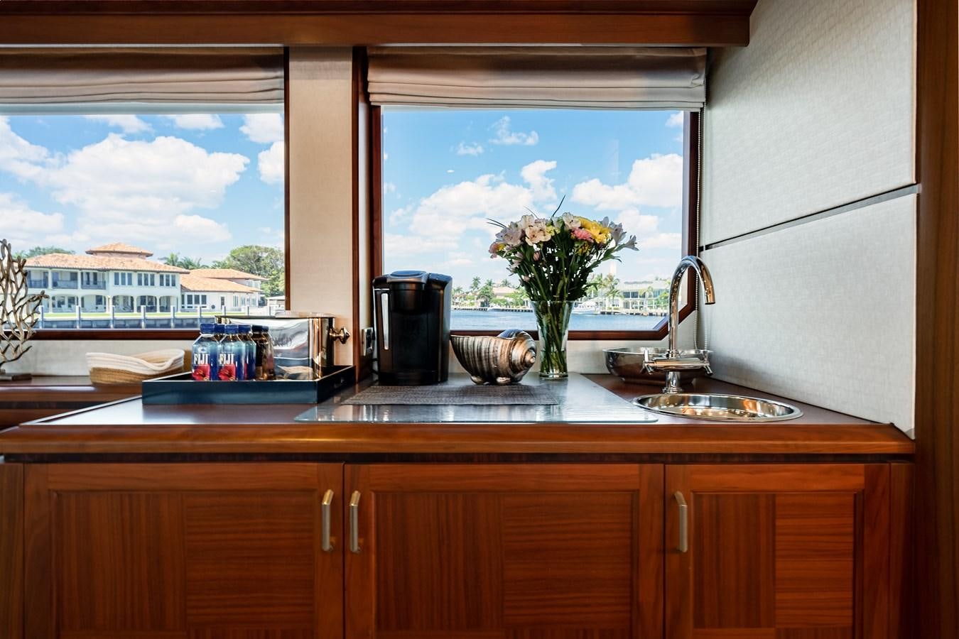 a kitchen counter with a window aboard UNCORKED Yacht for Sale