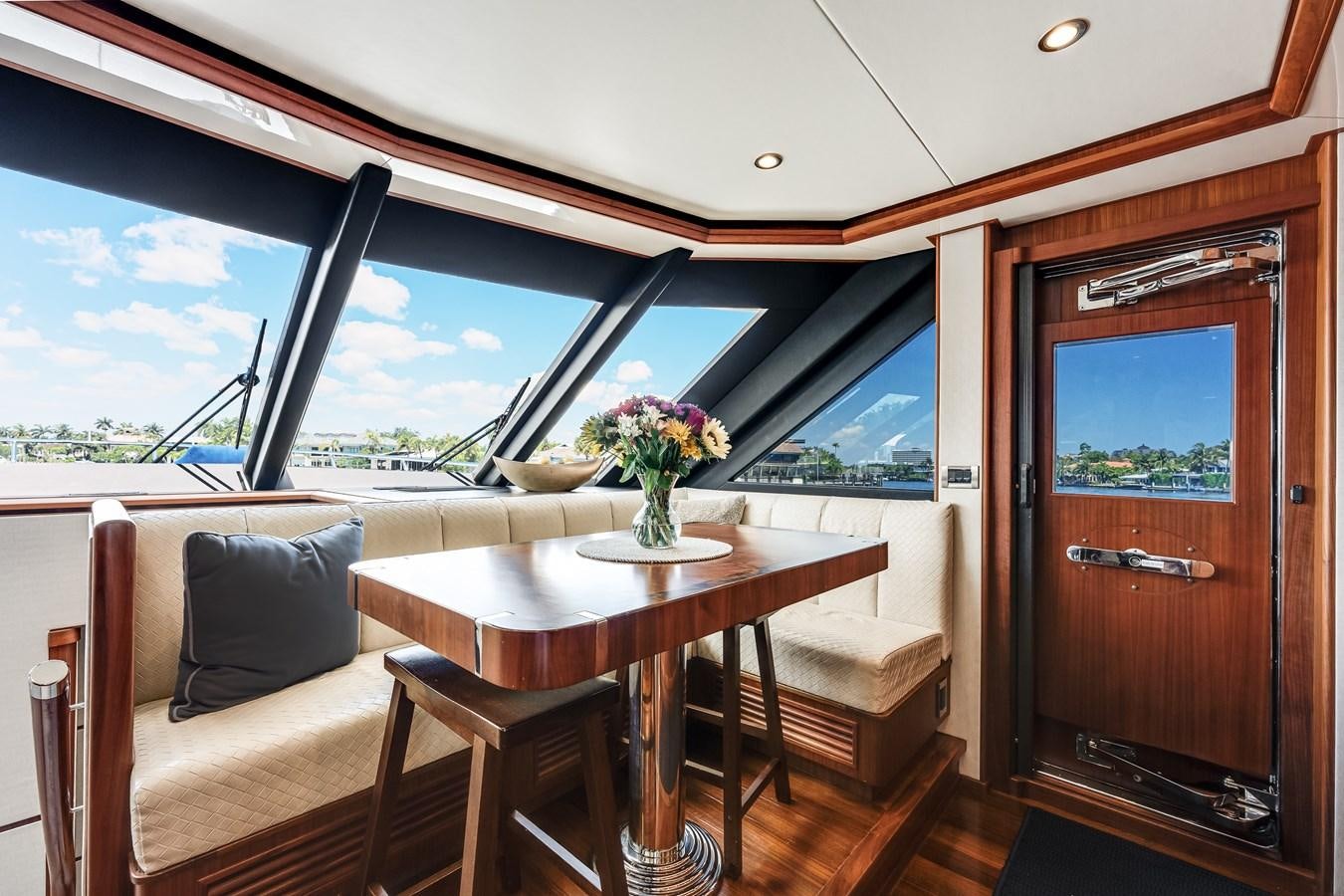 a room with a table and chairs aboard UNCORKED Yacht for Sale