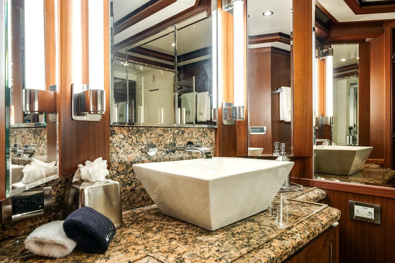 a bathroom with a large bathtub aboard UNCORKED Yacht for Sale