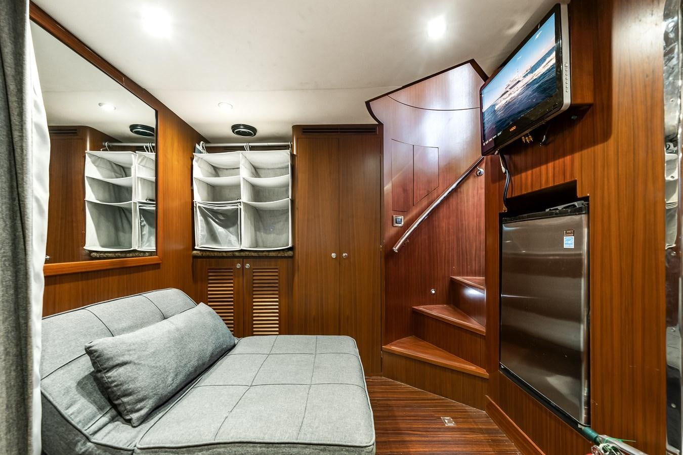 a bed and a tv in a room aboard UNCORKED Yacht for Sale