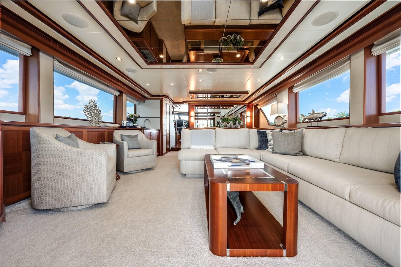 a living room with a couch and a coffee table aboard UNCORKED Yacht for Sale