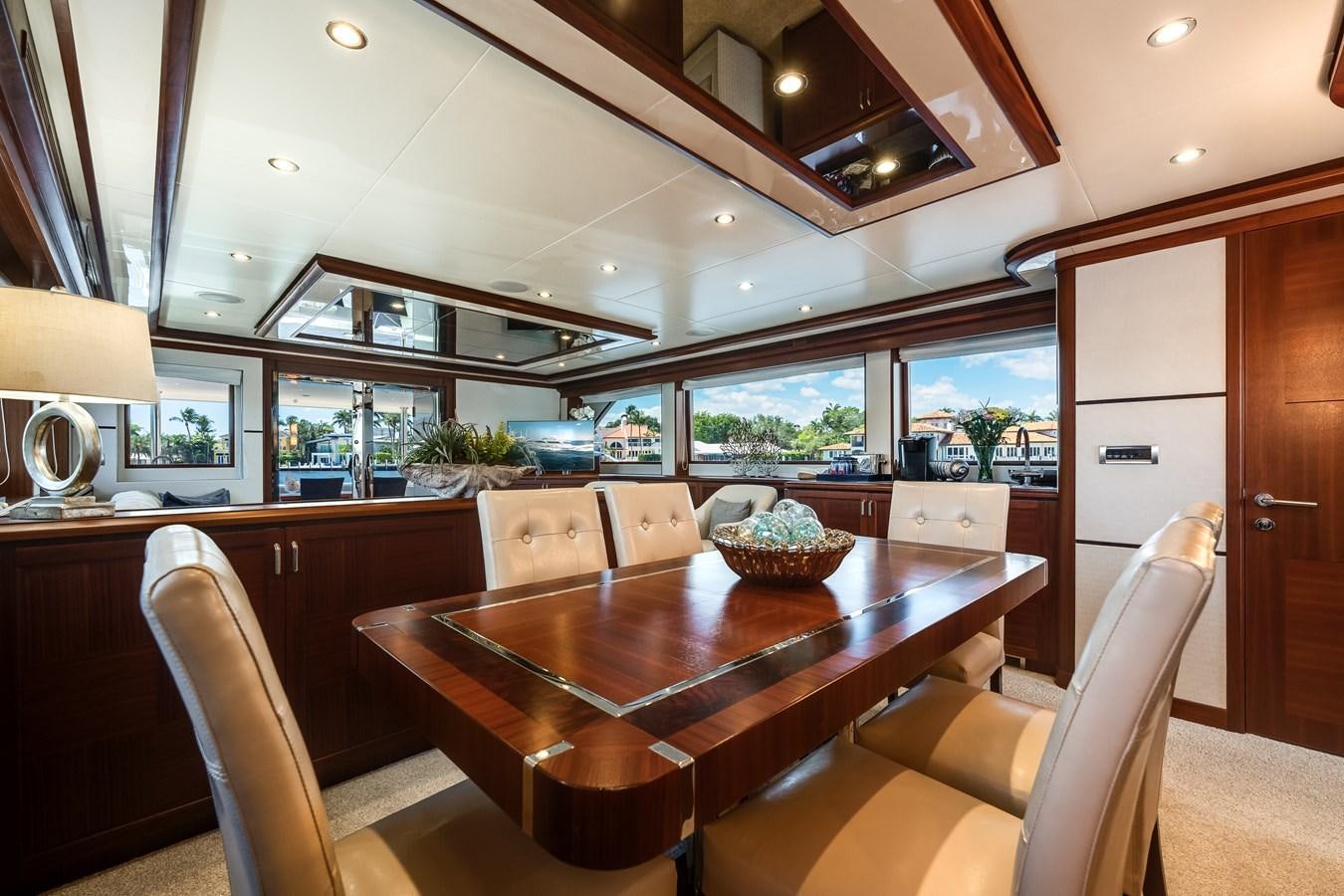 a kitchen with a table and chairs aboard UNCORKED Yacht for Sale
