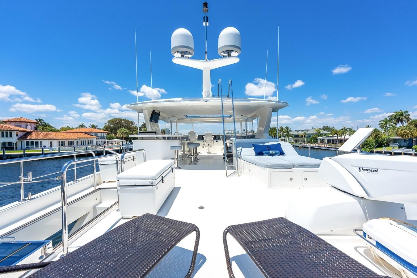 a large white boat with a large white antenna on top aboard UNCORKED Yacht for Sale