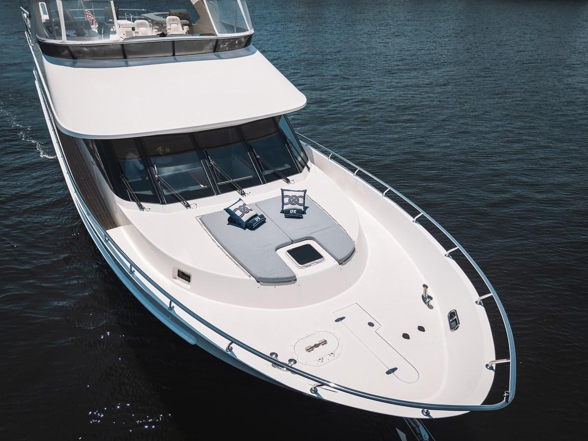 a white yacht on the water aboard UNCORKED Yacht for Sale