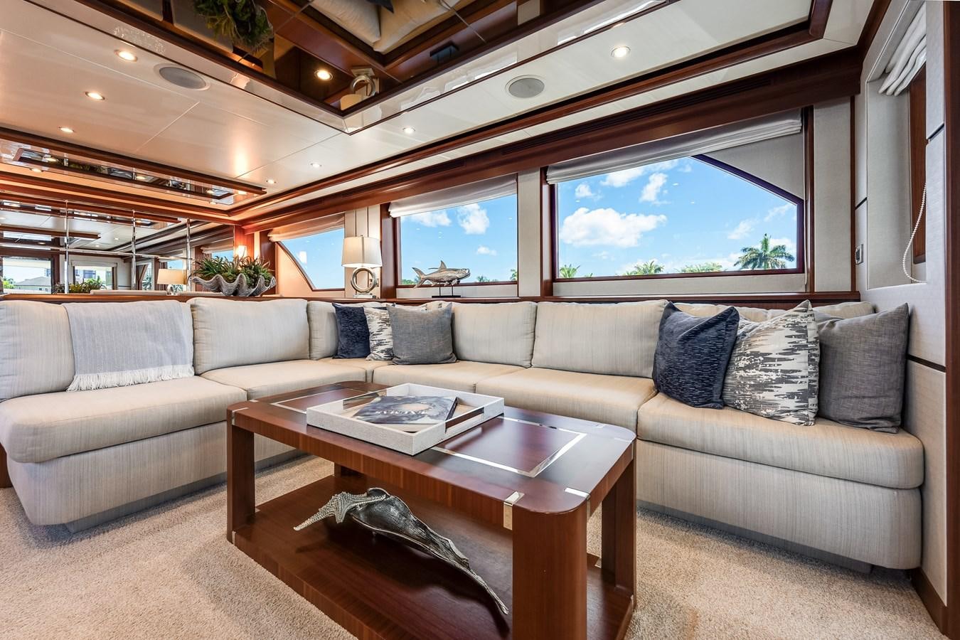 a living room with a couch and a coffee table aboard UNCORKED Yacht for Sale