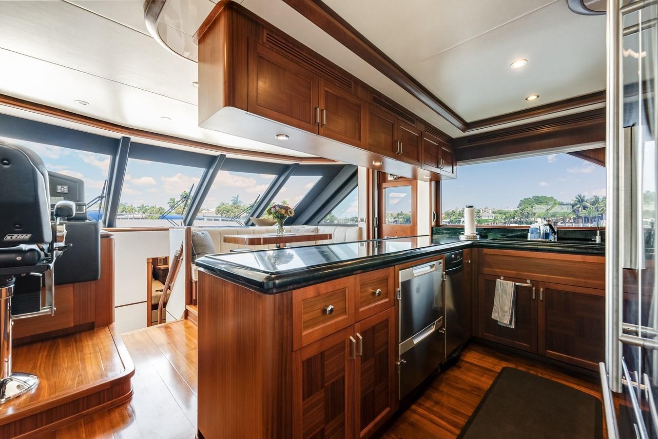 a kitchen with wooden cabinets aboard UNCORKED Yacht for Sale