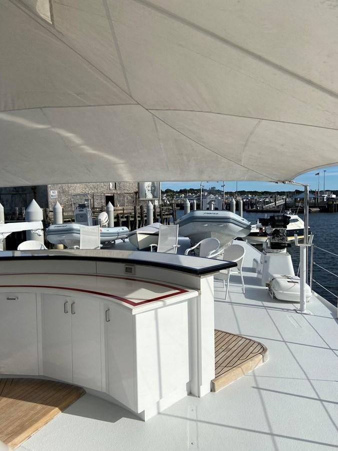 a room with a table and chairs aboard BUCKPASSER Yacht for Sale