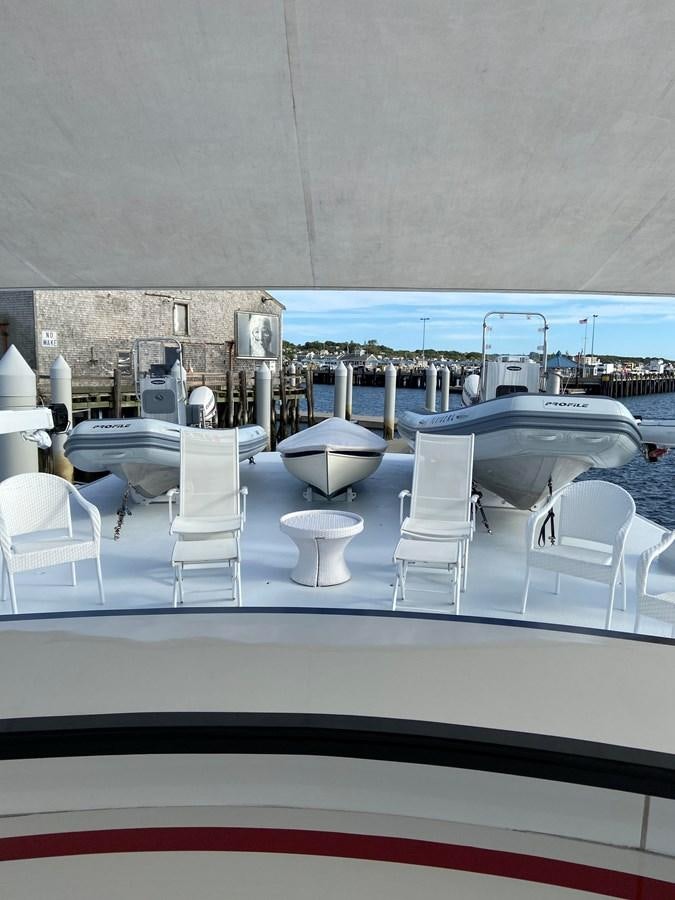 a room with a table and chairs aboard BUCKPASSER Yacht for Sale