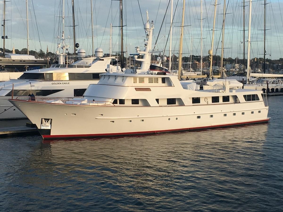 a large white boat in the water aboard BUCKPASSER Yacht for Sale