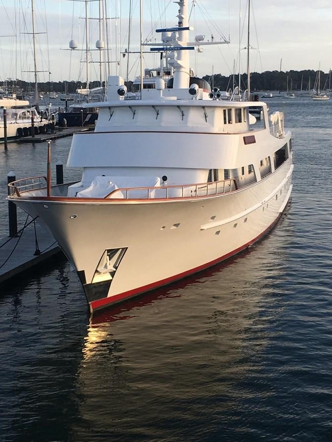 a large white boat in the water aboard BUCKPASSER Yacht for Sale